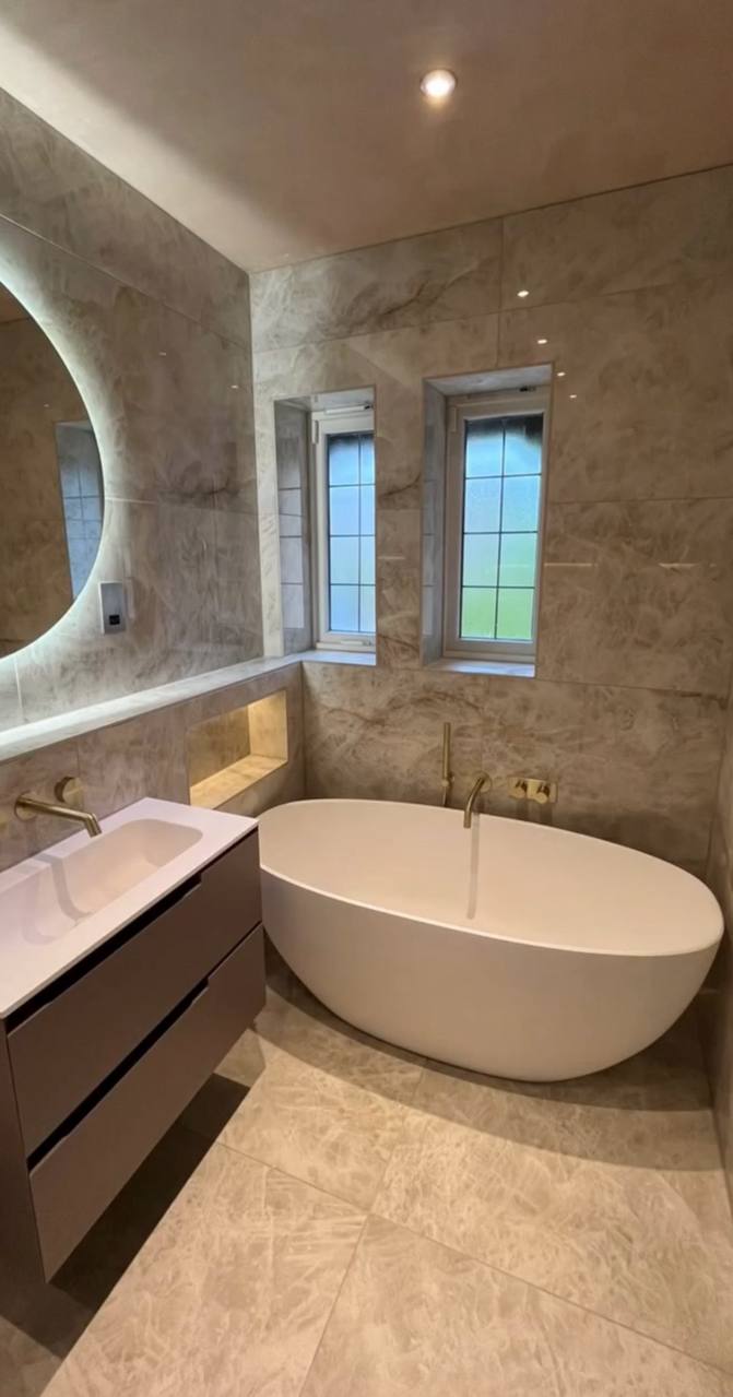 Luxury bathroom renovation in North London with freestanding bath