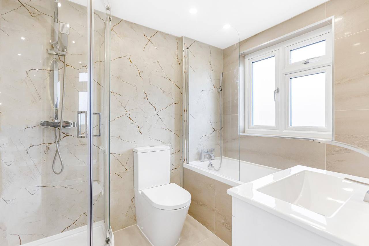Marble-effect bathroom installation in North London